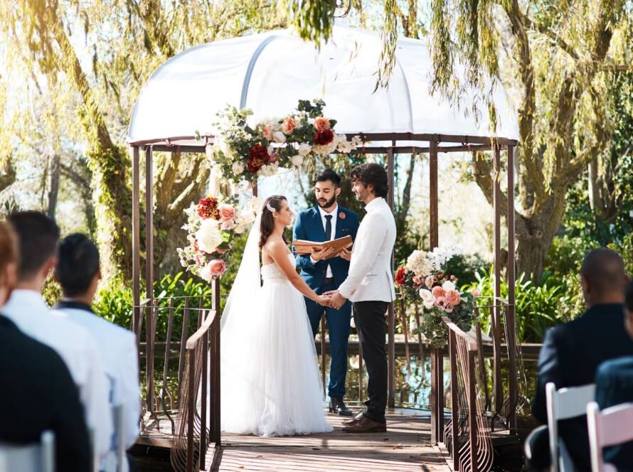 A couple gets married in an outdoor micro wedding venue.